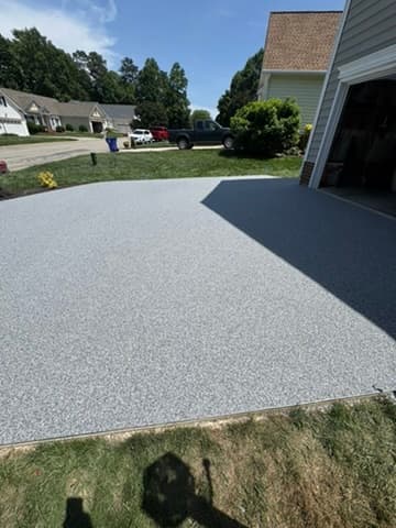 Resin‑bound driveway with clean edge and tape‑off
